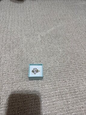 Elegant Gold Ring with cubic zirconia diamond  and Green Side Stones.